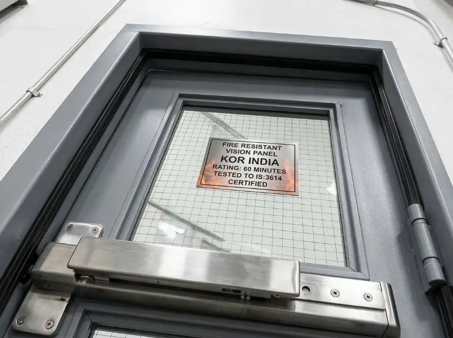 Detailed view of vision panel fire doors with fire-resistant glass panel, ideal for offices needing visibility and 60-minute fire rating in India